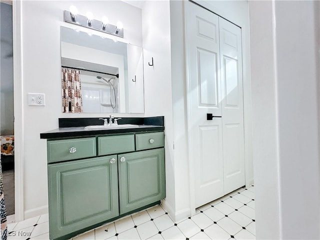 full bathroom with tile patterned floors, baseboards, curtained shower, and vanity