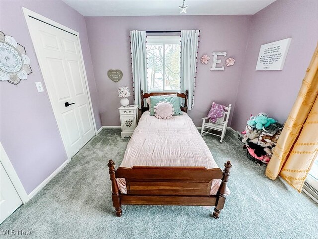 carpeted bedroom with baseboards