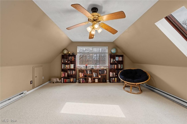 interior space with lofted ceiling, carpet, and a baseboard radiator