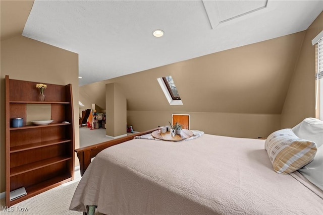 bedroom featuring carpet floors, vaulted ceiling with skylight, and recessed lighting