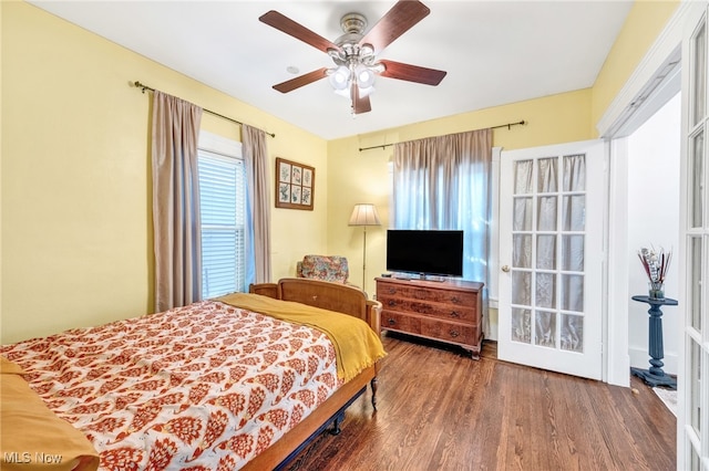 bedroom with a ceiling fan and wood finished floors