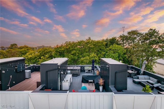 wooden deck featuring outdoor lounge area and central air condition unit