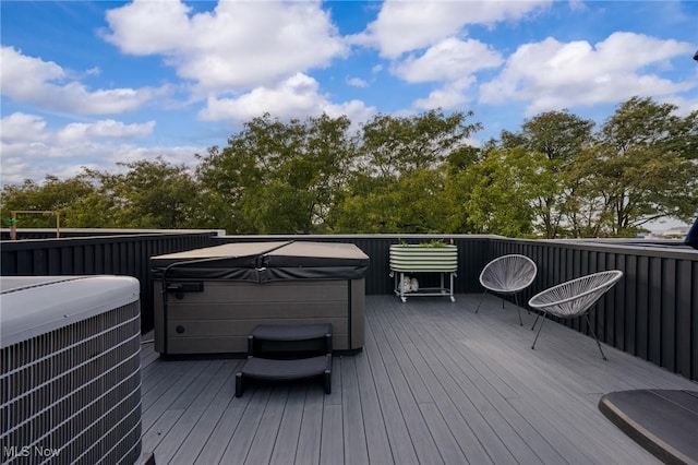 deck with cooling unit and a hot tub