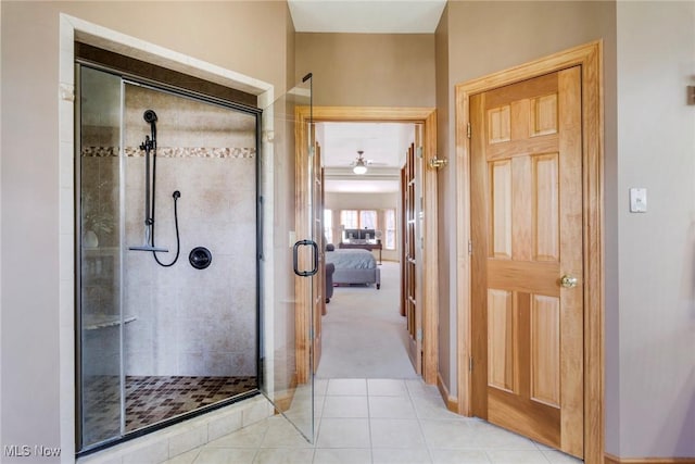 full bathroom featuring a shower stall, connected bathroom, and tile patterned flooring