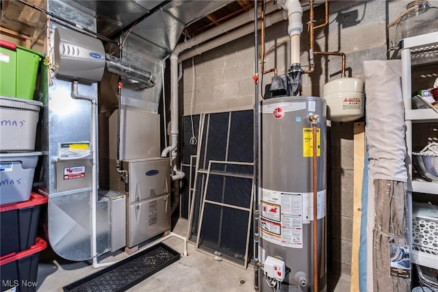 utility room with heating unit and water heater