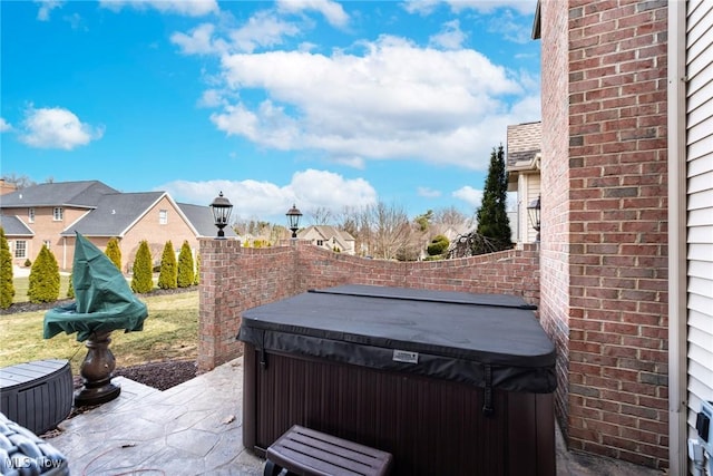 view of patio with a hot tub