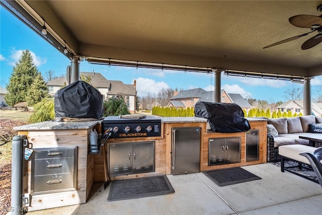 view of patio featuring a ceiling fan and area for grilling