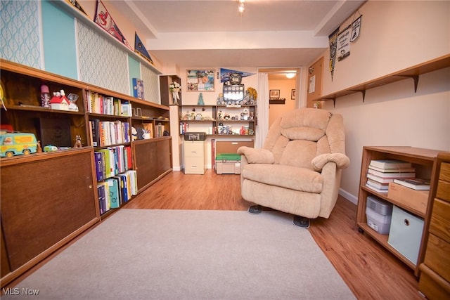 sitting room featuring wood finished floors