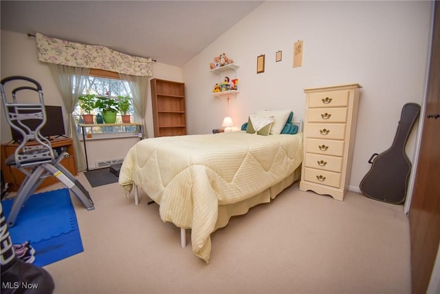 carpeted bedroom featuring vaulted ceiling