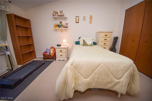 carpeted bedroom featuring a closet