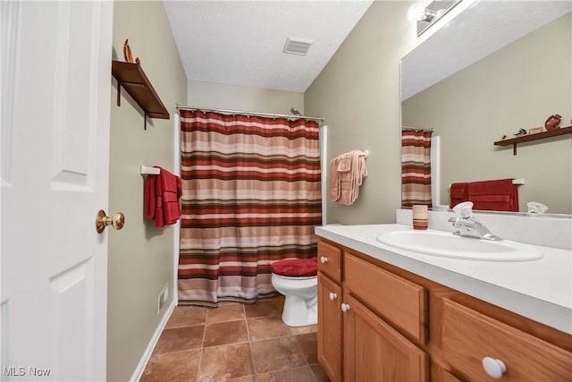 bathroom featuring visible vents, toilet, tile patterned floors, curtained shower, and vanity