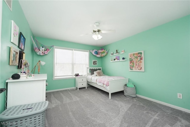 carpeted bedroom with baseboards and a ceiling fan