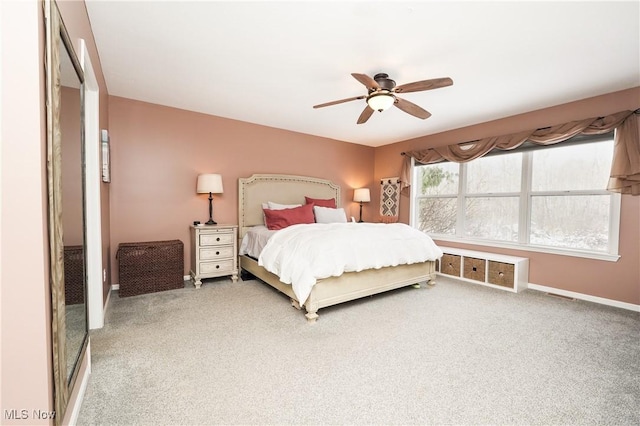 bedroom featuring carpet, a ceiling fan, and baseboards