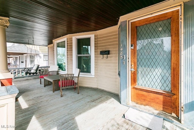 property entrance featuring covered porch