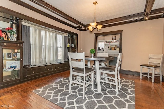 dining room with baseboards, coffered ceiling, hardwood / wood-style flooring, beamed ceiling, and a chandelier