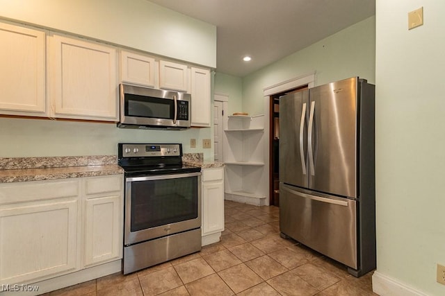 kitchen featuring light tile patterned floors, appliances with stainless steel finishes, light countertops, open shelves, and recessed lighting