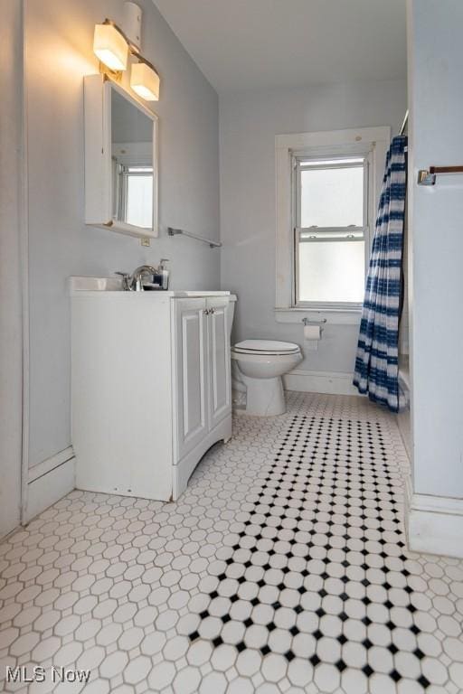 bathroom featuring toilet and vanity