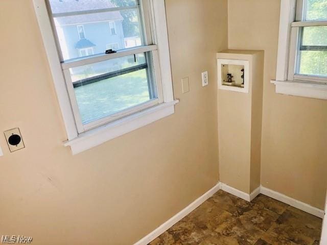 laundry room with laundry area, baseboards, washer hookup, and electric dryer hookup