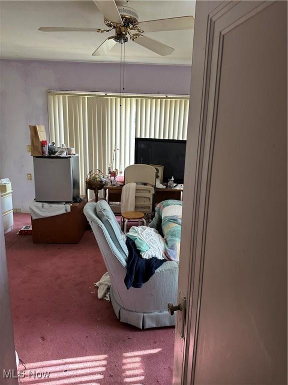 carpeted bedroom with ceiling fan