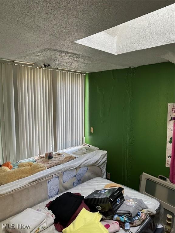 bedroom featuring a textured ceiling