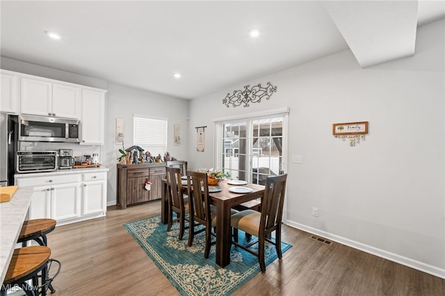 dining area featuring recessed lighting, a toaster, visible vents, baseboards, and light wood-type flooring