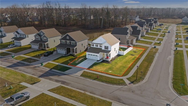 birds eye view of property with a residential view