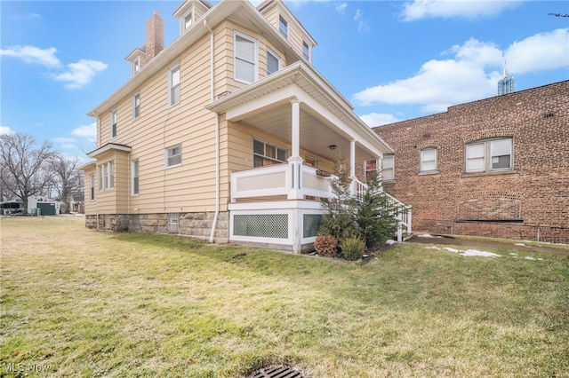 view of property exterior featuring a lawn