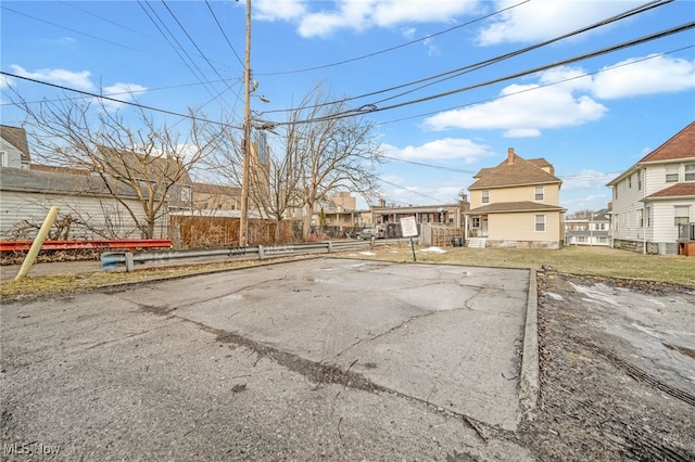 view of yard featuring a residential view and fence