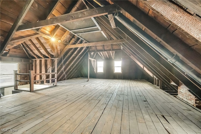 attic featuring an upstairs landing