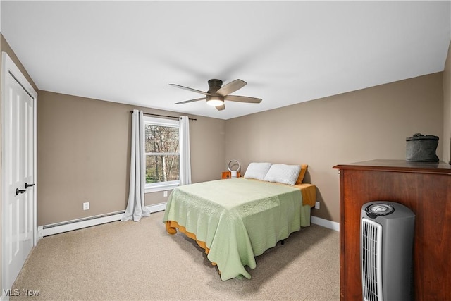 bedroom featuring a baseboard radiator, carpet flooring, ceiling fan, and baseboards