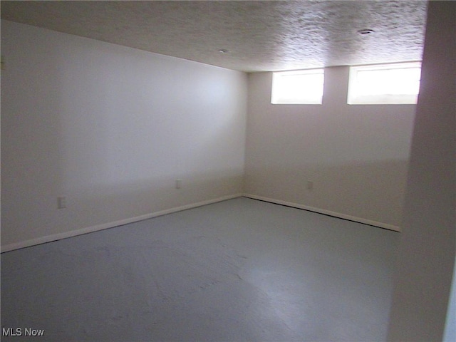 empty room featuring a textured ceiling