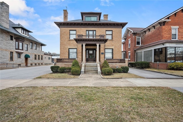 traditional style home featuring brick siding and a chimney