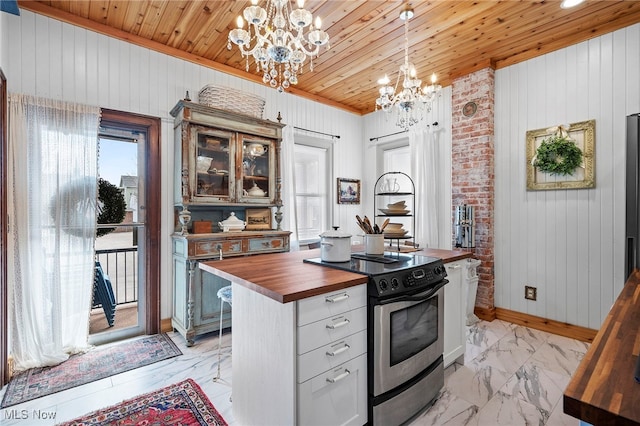 kitchen featuring wood ceiling, wood counters, an inviting chandelier, marble finish floor, and stainless steel range with electric cooktop