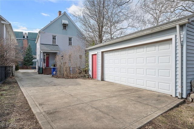 view of front of home with an outbuilding and a detached garage