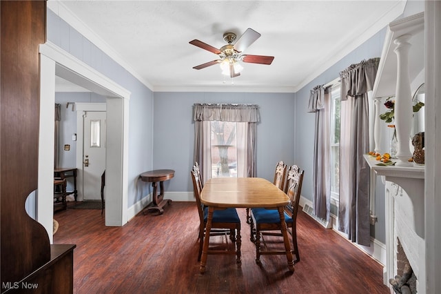 dining space featuring plenty of natural light, wood finished floors, a ceiling fan, and baseboards