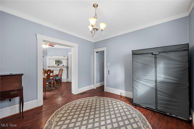 bedroom featuring a notable chandelier, wood finished floors, visible vents, baseboards, and crown molding