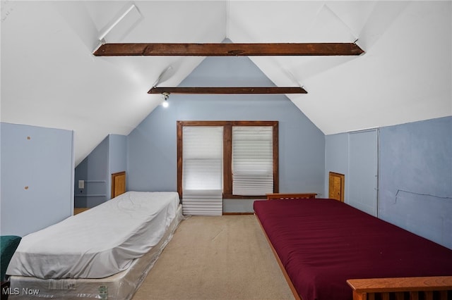 bedroom featuring vaulted ceiling with beams and carpet