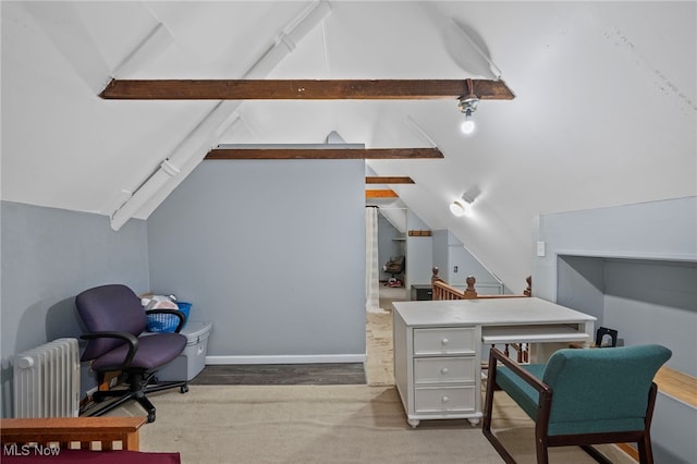 office featuring vaulted ceiling with beams, radiator heating unit, and baseboards