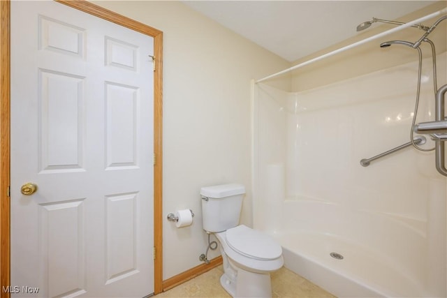 full bath featuring baseboards, toilet, and walk in shower