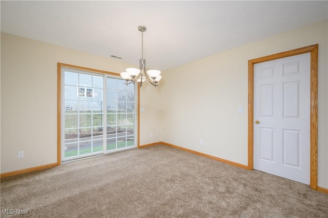 unfurnished room featuring a chandelier, carpet flooring, visible vents, and baseboards