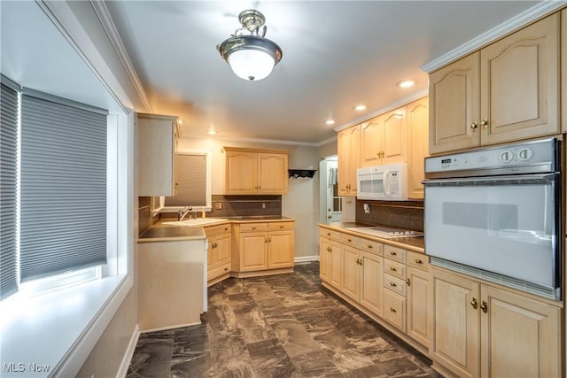 kitchen with white appliances, light brown cabinets, ornamental molding, and backsplash