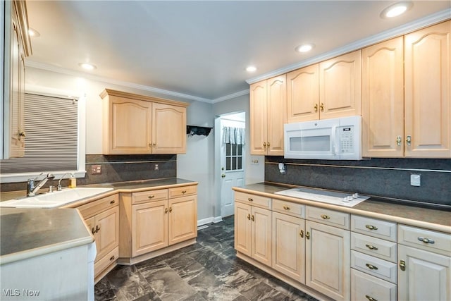 kitchen with white appliances, crown molding, a sink, and light brown cabinetry