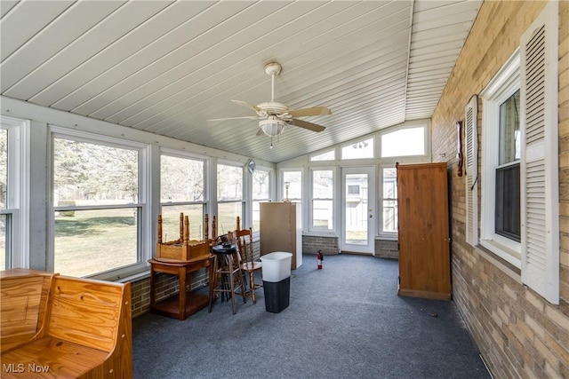 sunroom / solarium with lofted ceiling and ceiling fan