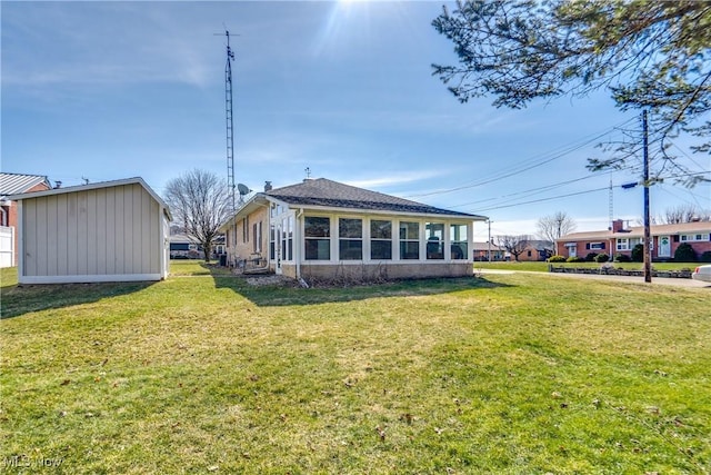 rear view of property featuring a yard