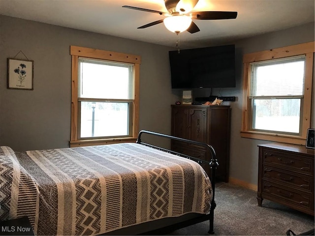 bedroom with light carpet and ceiling fan