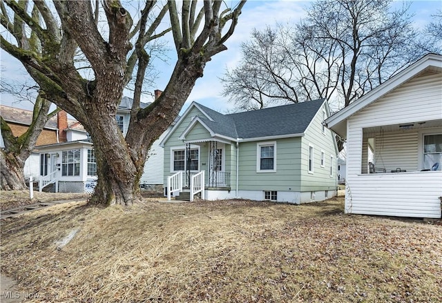 view of front of property featuring roof with shingles