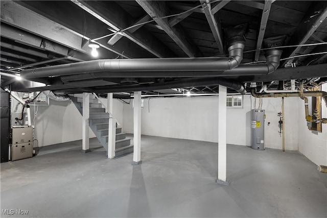 unfinished basement with water heater, stairs, and heating unit