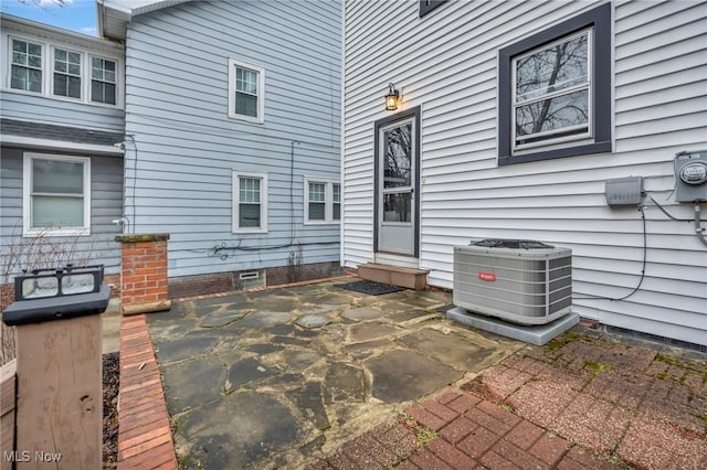 view of patio with entry steps and central AC