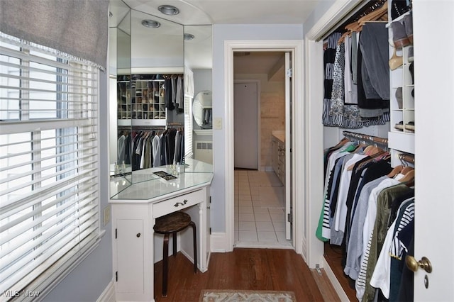 spacious closet featuring dark wood finished floors