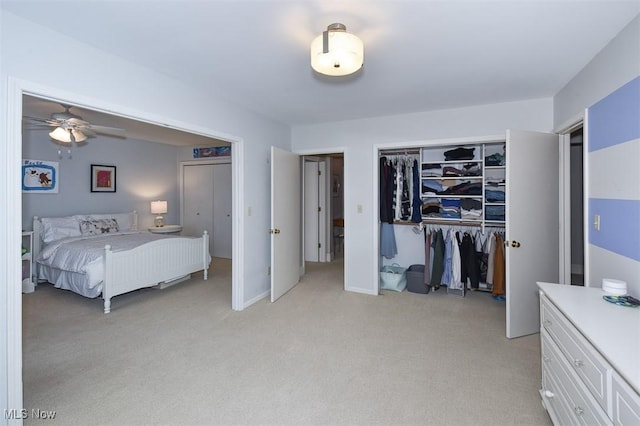 bedroom with light carpet and a closet